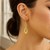 Shiny Infinity Style Earrings in 14k Yellow Gold