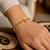 14K Yellow Gold Charm Lock Rolo Chain Bracelet (5.10 mm)