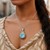 Cushion Sky Blue Topaz and Diamond Accented Popcorn Cushion Pendant in 18k Yellow Gold and Sterling Silver (.02cttw)