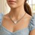 Flat Heart Stationed Chain Necklace in Rhodium Plated Sterling Silver