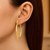 14k Yellow Gold Twist Motif Oval Shape Hoop Earrings
