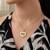 Intertwined Hearts Pendant in 14k Two-Tone Gold