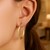 Textured Oval Shape Hoop Earrings in 14k Yellow Gold