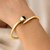14k Yellow Gold Crossover Style Hinged Bangle Bracelet with Onyx and Diamonds (3.40 mm)