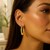 Textured Graduated Oval Hoop Earrings in 14k Yellow Gold